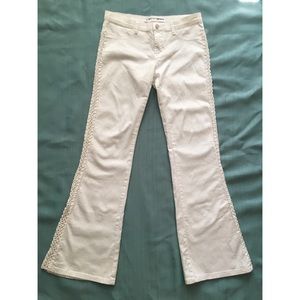 White stretch flared jeans.